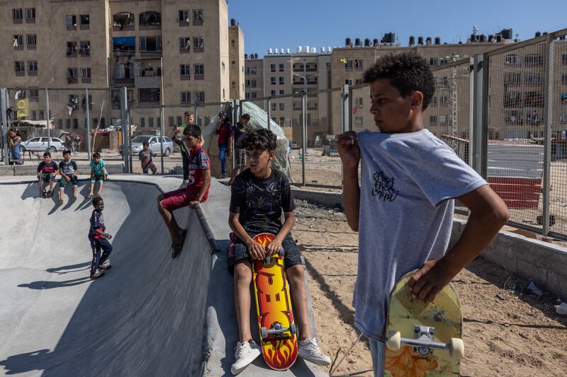 Children hang out at a northern Gaza skate park in the late afternoon.