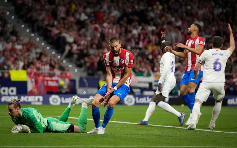 Atletico Madrid's Yannick Carrasco, centre, reacts after missing a chance. AP Photo