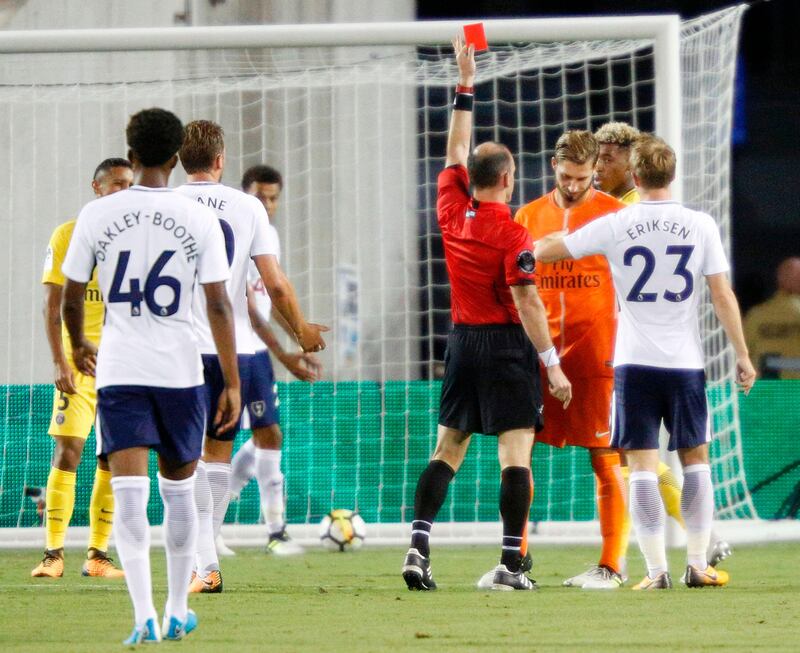Paris Saint-Germain goalkeeper Kevin Trapp is sent off by referee Ted Unkel at the start of the second half of their friendly match against Tottenham Hotspur at Orlando. Trapp received the red card for touching the ball outside the 18-yard box. Gregg Newton / AFP