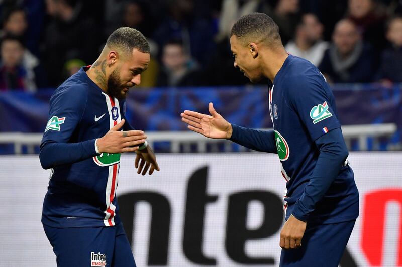 Paris Saint-Germain forward Kylian Mbappe , right, is congratulated by Neymar after scoring in their 5-1 win over Lyon in the French Cup. AFP