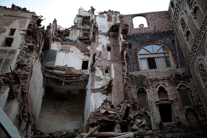 The remains of damaged buildings in the Yemeni capital. AP