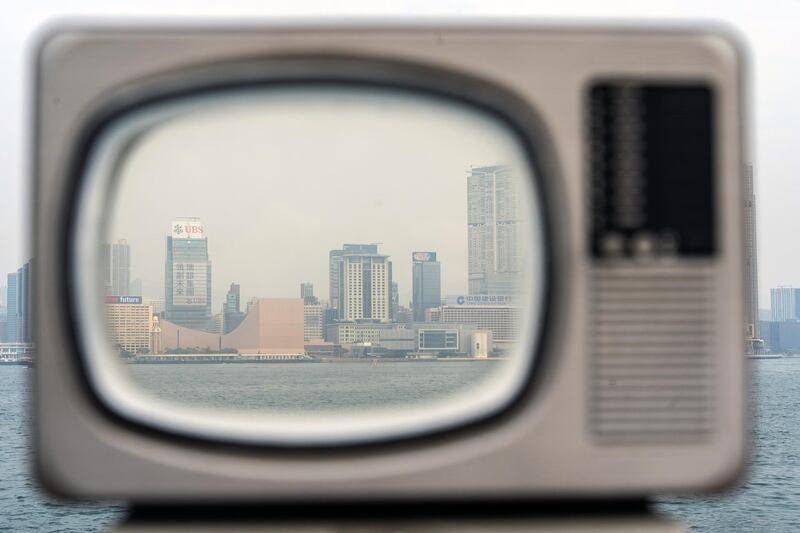 Buildings in Kowloon are seen across the Victoria Harbor through an installation in Hong Kong, China. Bloomberg