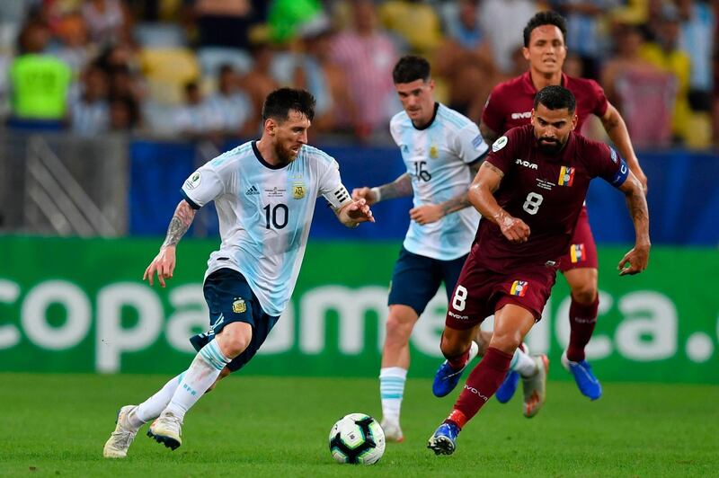 Argentina's Lionel Messi takes on Venezuela's Tomas Rincon. AFP