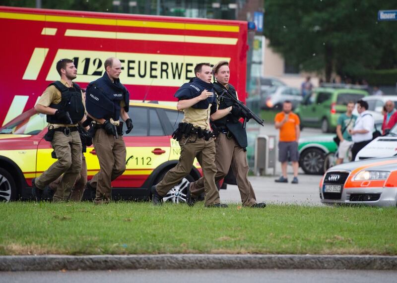 Policemen arrive at Munich’s OEZ shopping mall after shootings were reported inside on July 22, 2016. Matthias Balk /dpa via AP