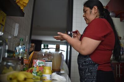 Mexican domestic worker Ignacia Ponciano prepares lunch at the house where she has worked for over 30 years in Mexico City on January 18, 2019. The working conditions of domestics in Latin America, to whom director Alfonso Cuaron pays homage in his recent movie 'Roma', is slowly reaching a legal framework. Whilst several countries in the region have established laws for the sector in the last decade, other simultaneous realities such as economic crises and migration, are hampering those conquests and ambitions of formality. / AFP / Rodrigo ARANGUA
