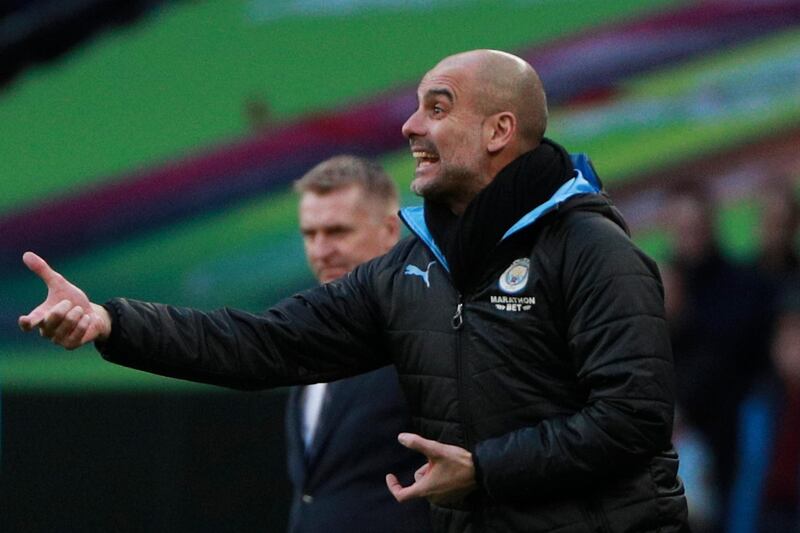 Manchester City manager Pep Guardiola gives directions to his players. AP Photo