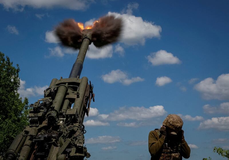 Ukrainian service members fire a shell from a M777 Howitzer in the Donetsk region as Russia's attack on Ukraine continues. Reuters