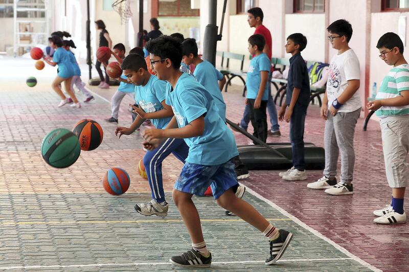 DUBAI , UNITED ARAB EMIRATES , JULY 4 – 2018 :- Students from grade 3 to 8 taking part in the basketball summer camp held at Indian High School in Garhoud area in Dubai.  ( Pawan Singh / The National )  For News. Story by Anam Rizvi