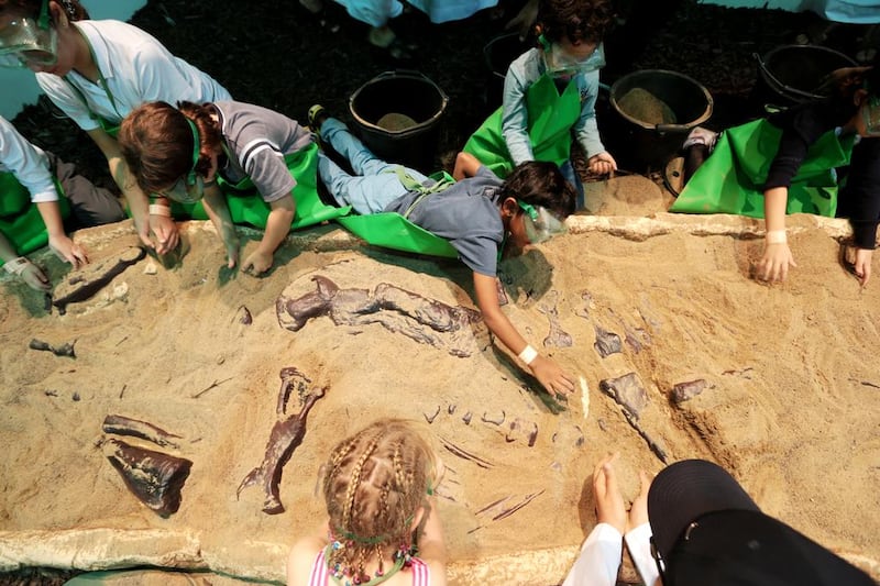 Children participate in the dig-a-dinosaur activity at last year’s Abu Dhabi Science Festival. Christopher Pike / The National