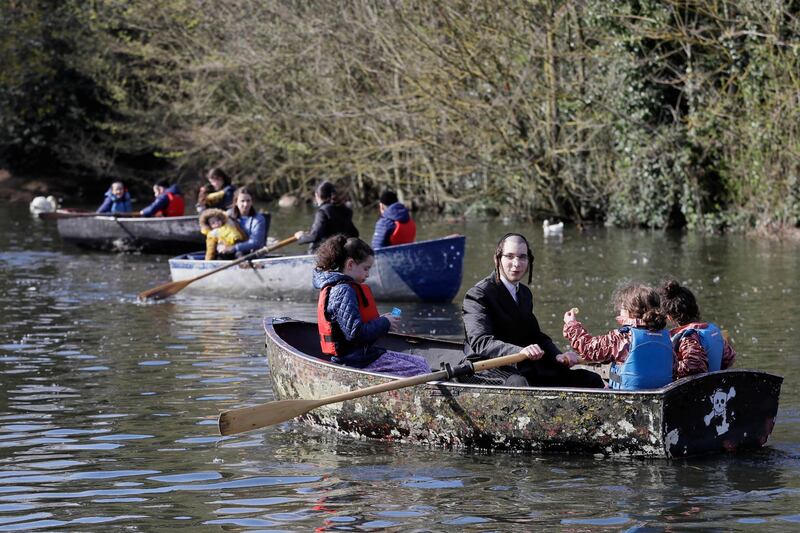 Families enjoy a boating lake in Finsbury Park, London. AP Photo