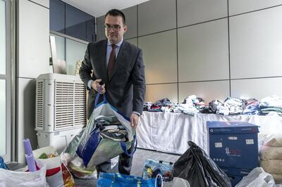 DUBAI, UNITED ARAB EMIRATES. 14 MAY 2018. Zen Tower fire in the Marina. Hotel Manager Agusti Curto Calbet looks at goods donated by the public that are being collected at the Wyndham Hotel. (Photo: Antonie Robertson/The National) Journalist: Nicke Webster. Section: National.