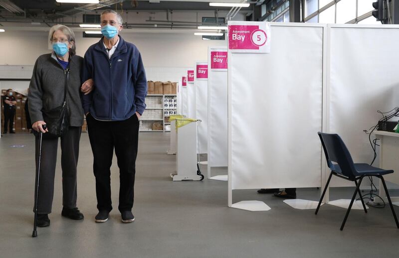 Southampton residents Peter and Margaret Brownsea wait to receive the Oxford/AstraZeneca Covid-19 vaccine at a temporary vaccine centre set up at Basingstoke Fire Station. AFP