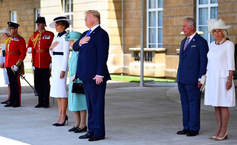 Britain's Queen Elizabeth II (4L) stands with US President Donald Trump (C), US First Lady Melania Trump (3L), Britain's Prince Charles, Prince of Wales (2R) and Britain's Camilla, Duchess of Cornwall as they listen to the US national anthem during a welcome ceremony at Buckingham Palace in central London. AFP