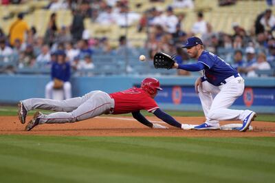 Los Angeles Angels designated hitter Shohei Ohtani dives into first base to beat a throw to Los Angeles Dodgers first baseman Freddie Freeman Photo: Kirby Lee-USA TODAY Sports