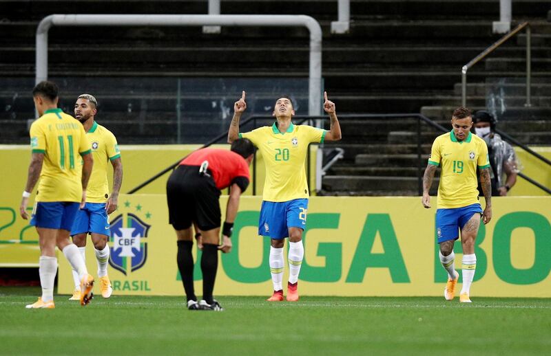Roberto Firmino celebrates scoring their third goal. Reuters