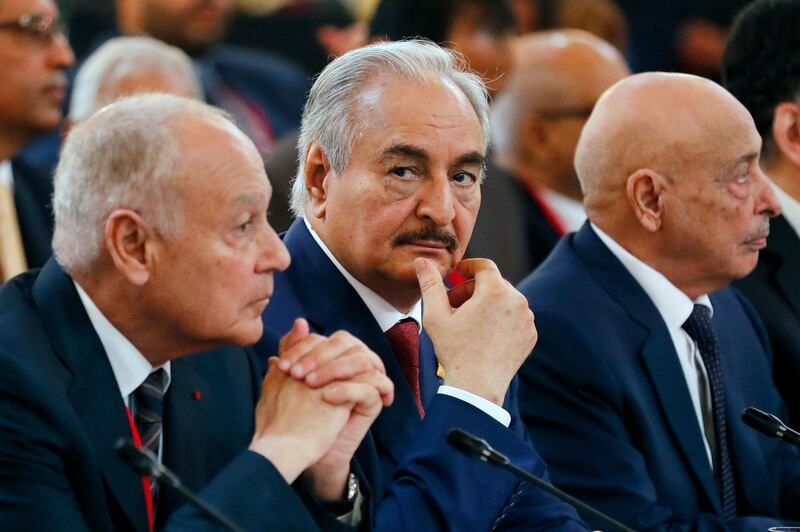 epa06770318 Libya Chief of Staff, Marshall Khalifa Haftar (C) and President of the Libyan House of Representatives in Tobruk Aguila Saleh Issa (R) attend the International Congress on Libya at the Elysee Palace in Paris, France, 29 May 2018.  EPA/ETIENNE LAURENT / POOL MAXPPP OUT