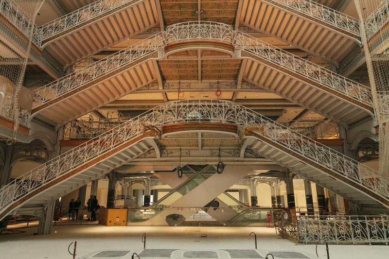 Wrought-iron balconies and banisters stand on the grand staircase in the atrium of the Samaritaine department store, operated by LVMH Moet Hennessy Louis Vuitton, during ongoing renovation work in Paris, France, on Tuesday, Nov. 19, 2019. The world’s biggest luxury group LVMH, controlled by billionaire Bernard Arnault--is set to reopen the Samaritaine department store next April after 15 years. Photographer: Laura Stevens/Bloomberg