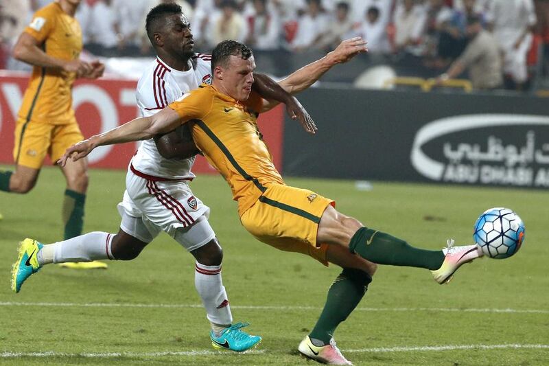 UAE winger Ismail Al Hammadi, left, vies with Australia’s Brad Smith. Karim Sahib / AFP