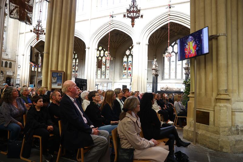 Members of the public watch the funeral service inside Bath Abbey. Getty Images