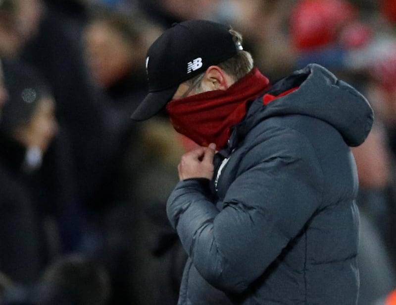 Liverpool manager Jurgen Klopp looks dejected after they concede their third goal. REUTERS