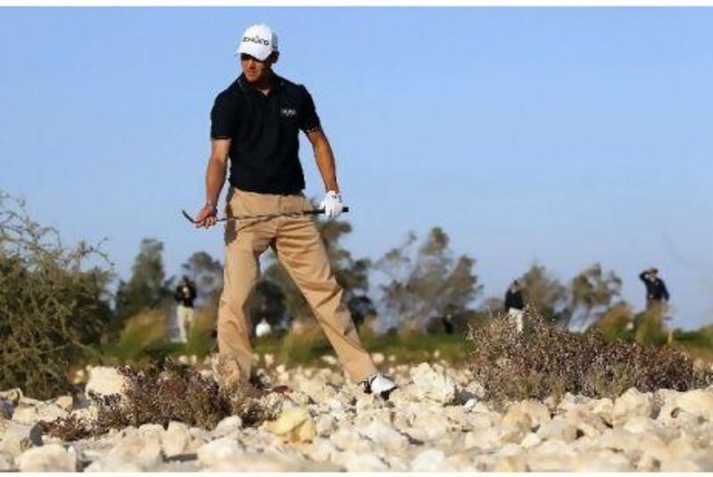 Germany's Martin Kaymer drove into the rocks on the 15th hole during a day of frustration at the Qatar Masters yesterday.