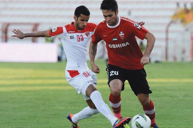 Luis Jimenez, right, gave Al Ahli a lift over Emirates with two late goals.