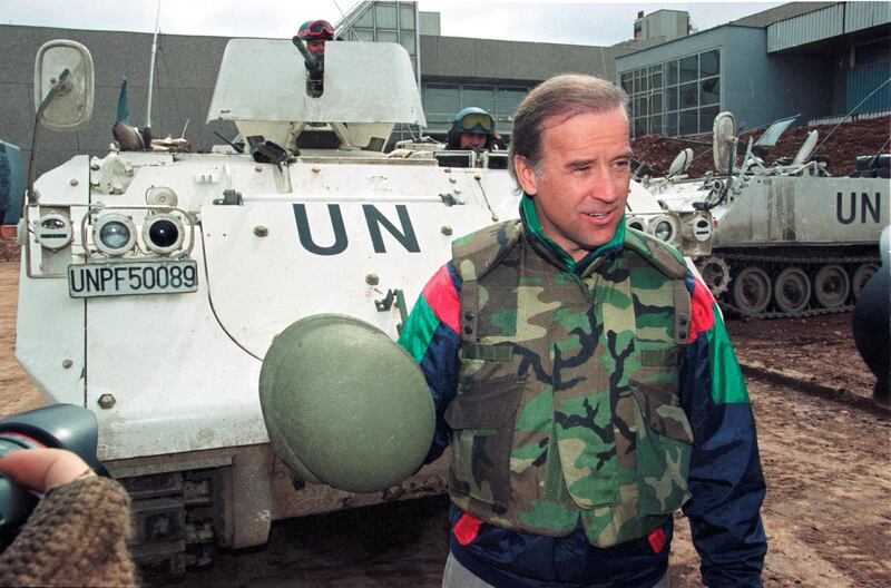 Sen. Joe Biden (D-DE) speaks to reporters in front of a Danish U.N. armoured personnel carrier at the airport in Sarajevo, Bosnia April 9, 1993. REUTERS/Chris Helgren