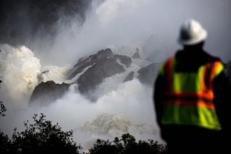 A water utility worker looks towards discharging water as it is released down a spillway as an emergency measure at the Oroville Dam in Oroville, California. Almost 200,000 people were under evacuation orders in northern California after a threat of catastrophic failure at the United States’ tallest dam. Josh Edelson / AFP