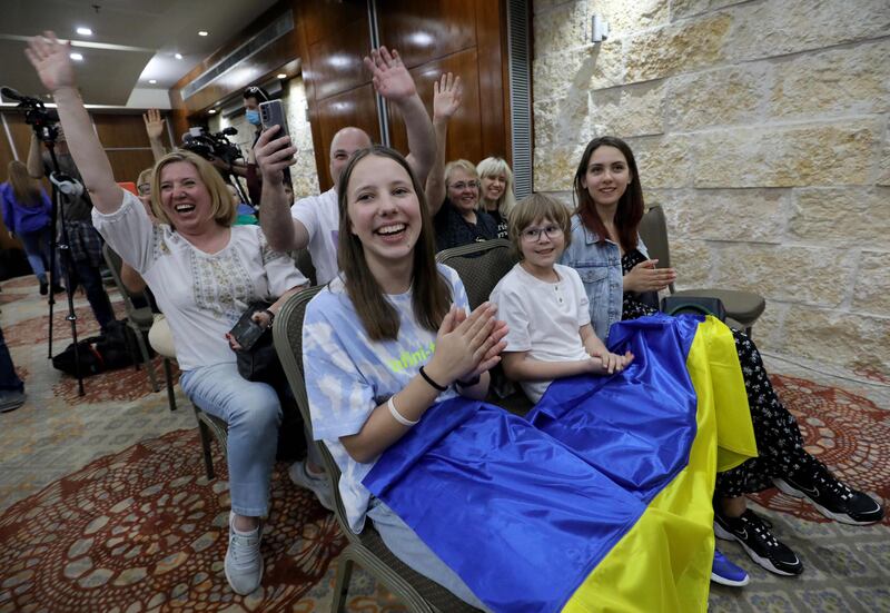 Ukrainian Jewish refugees cheer during a performance by Kalush Orchestra. AFP