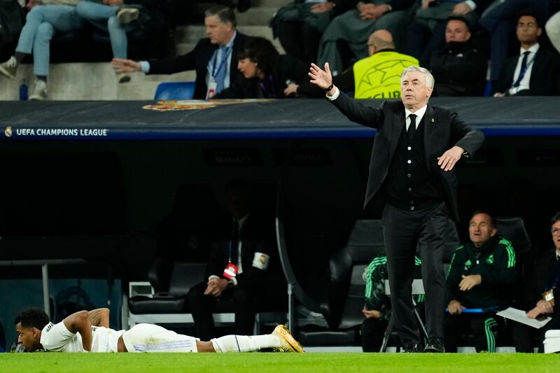 Real Madrid coach Carlo Ancelotti gestures on the touchline as Rodrygo lies prone. AP 