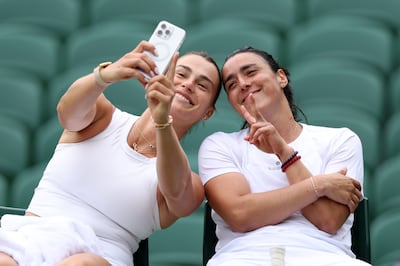 Aryna Sabalenka, left, and Ons Jabeur of Tunisa take a selfie during practice prior to Wimbledon 2024. Getty Images