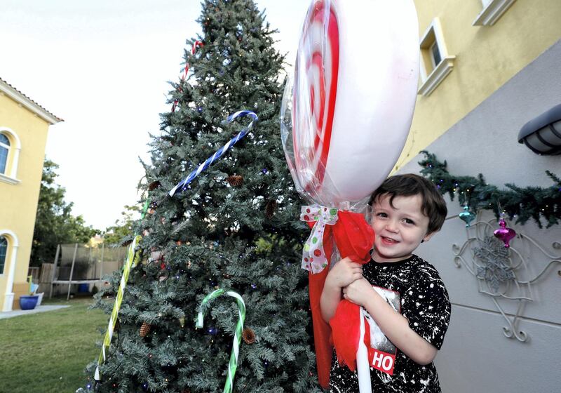 Dubai, United Arab Emirates - December 08, 2020: Christmas. Festive decorations by UAE residents. Lucy Gregory's house. Baxter aged 4. Tuesday, December 8th, 2020 in Dubai. Chris Whiteoak / The National