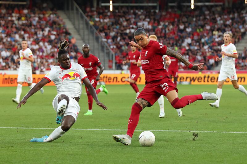 Salzburg defender Oumar Solet attempts a diving tackle against Liverpool striker Darwin Nunez. Getty