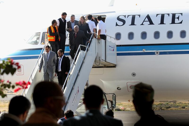 Kuwaiti ambassador to Yemen Fahd Almeie (L) disembarks from a Kuwait-chartered plane before carrying a Houthi delegation to UN-sponsored peace talks in Sweden, in Sanaa, 4 December 2018. EPA
