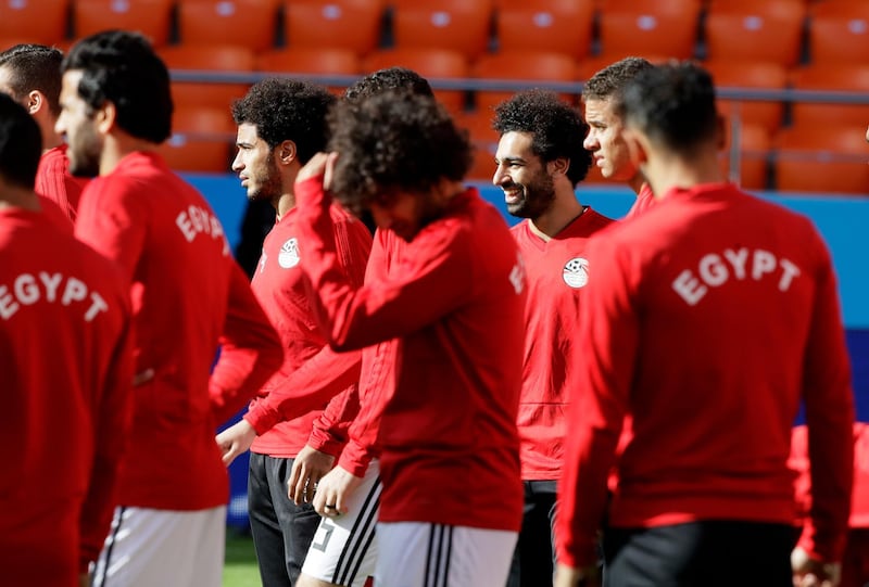Egypt's Mohamed Salah, third right, stands with his teammates during Egypt's training session. Mark Baker / AP Photo