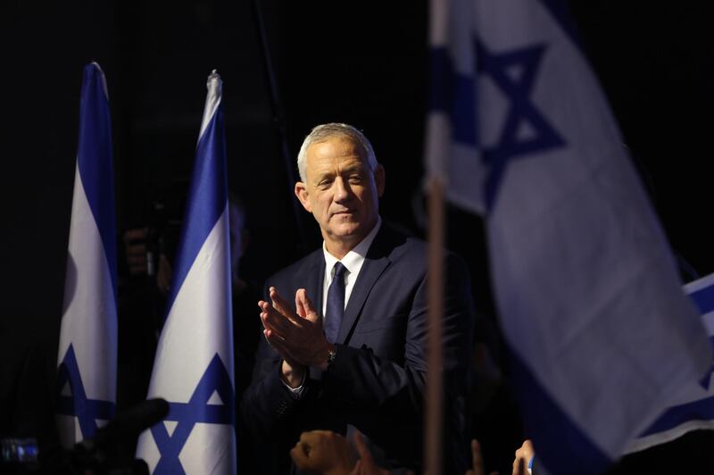 Benny Gantz gestures after giving a speech during a rally with supporters in Tel Aviv. EPA