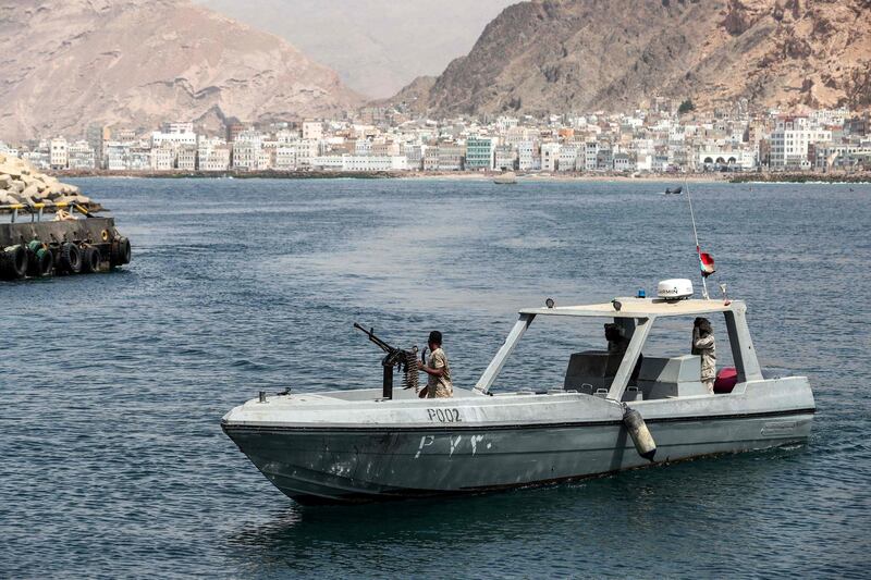 A Yemeni military patrol boat cruising past the docks in Mukalla. AFP