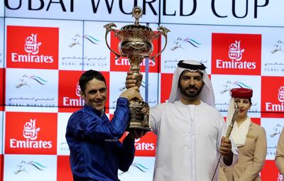 DUBAI , UNITED ARAB EMIRATES , MARCH 31  – 2018 :- Christophe Soumillon  with the Dubai World Cup trophy. Thunder Show (IRE) ridden by Christophe Soumillon  ( no 10  ) won the 9th horse race Dubai World Cup 2000m dirt during the Dubai World Cup held at Meydan Racecourse in Dubai. Also seen in the photo Trainer Saeed Bin Suroor on the right . ( Pawan Singh / The National ) For News/Sports. Story by Amith