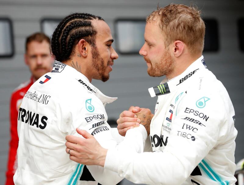 Formula One F1 - Chinese Grand Prix - Shanghai International Circuit, Shanghai, China - April 14, 2019  Mercedes' Lewis Hamilton and Mercedes' Valtteri Bottas after the race  REUTERS/Aly Song