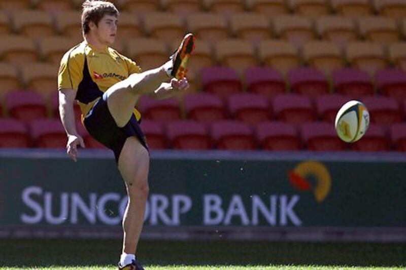 Australia's James O'Connor kicks a ball during a national team training session.