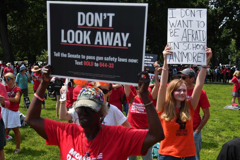 Activists wear orange, a colour representing gun violence in the US. AFP