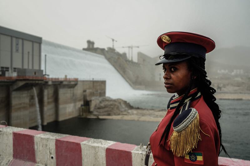 A member of Ethiopia's Republican March Band poses for photo in front of the Grand Ethiopian Renaissance Dam in Guba. AFP