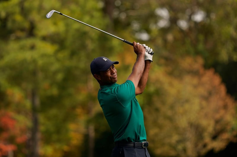 Tiger Woods hits a shot on the 12th hole during a practice round for the Masters. AP Photo