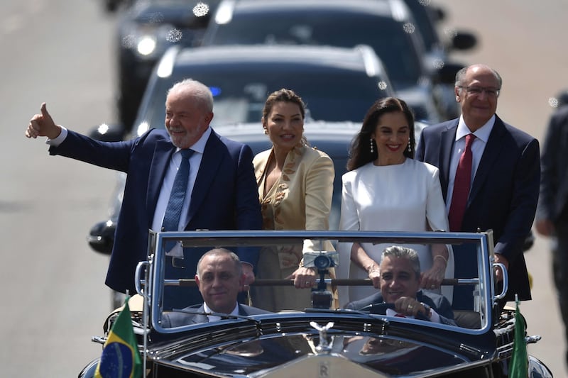 Brazil's president-elect Luiz Inacio Lula da Silva gives the thumbs-up on his way to the National Congress. Reuters