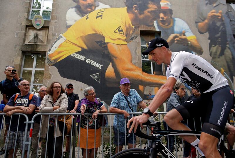 Cycling - Tour de France - Teams Presentation - La Roche-sur-Yon, France - July 5, 2018 - Team Sky rider Chris Froome of Britain arrives at the teams presentation, in front of a mural of five-times Tour de France winner Bernard Hinault. REUTERS/Stephane Mahe