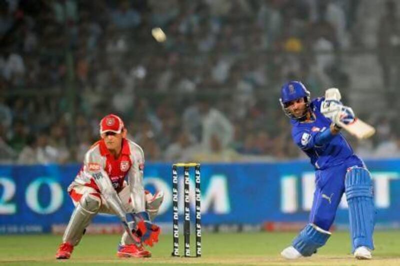 Rajasthan Royals batsman Ajinkya Rahane, right, shown here during a meeting last year with Kings XI Punjab, plays a shot during an IPL Twenty20 cricket match.  Raveendram / AP Photo