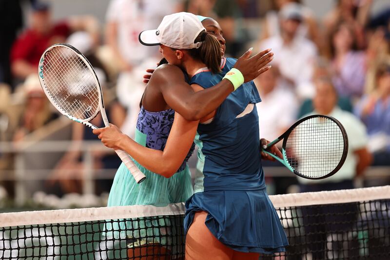 Iga Swiatek embraces Coco Gauff at the end of the match. Getty