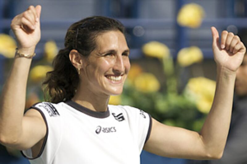 Virginie Razzano celebrates after defeating Kaia Kanepi during the semi-finals of the Dubai Tennis Championships.