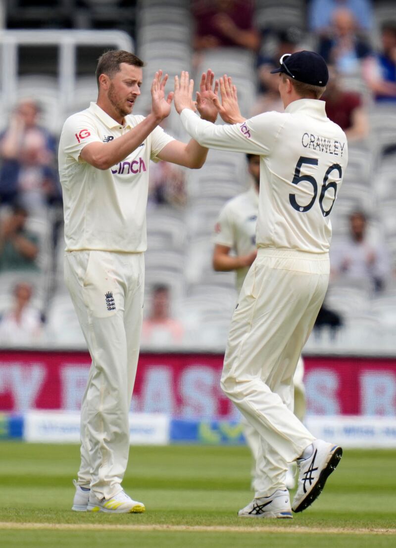 England's Ollie Robinson, left, celebrates taking the wicket of New Zealand's Neil Wagner at Lord's on Sunday.