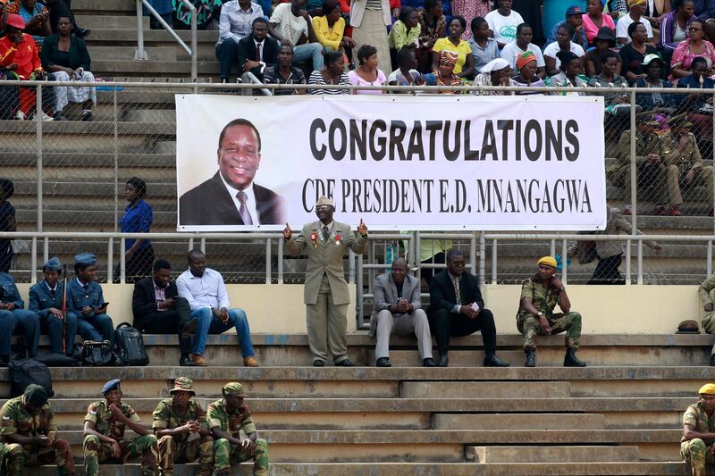 People gather for the presidential inauguration ceremony. Tsvangirayi Mukwazhi / AP Photo